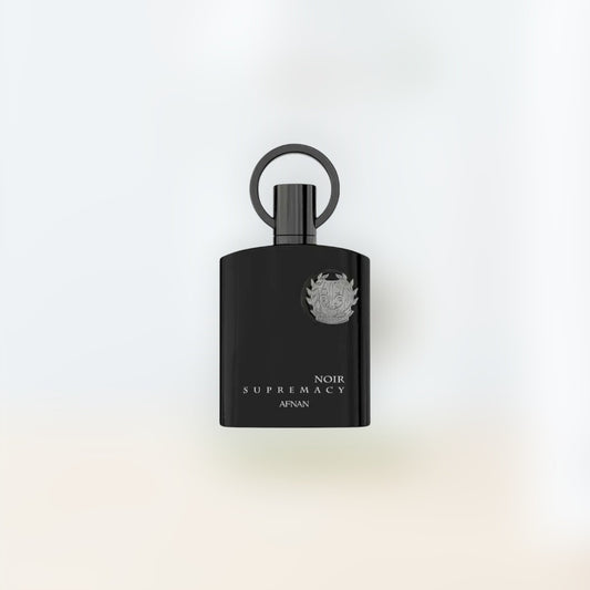 Trio Fragrance Afnan Supremacy Noir black perfume bottle with silver emblem and ring cap. Notes of bergamot, fir, violet, leather, lavender, pine, patchouli, and labdanum.